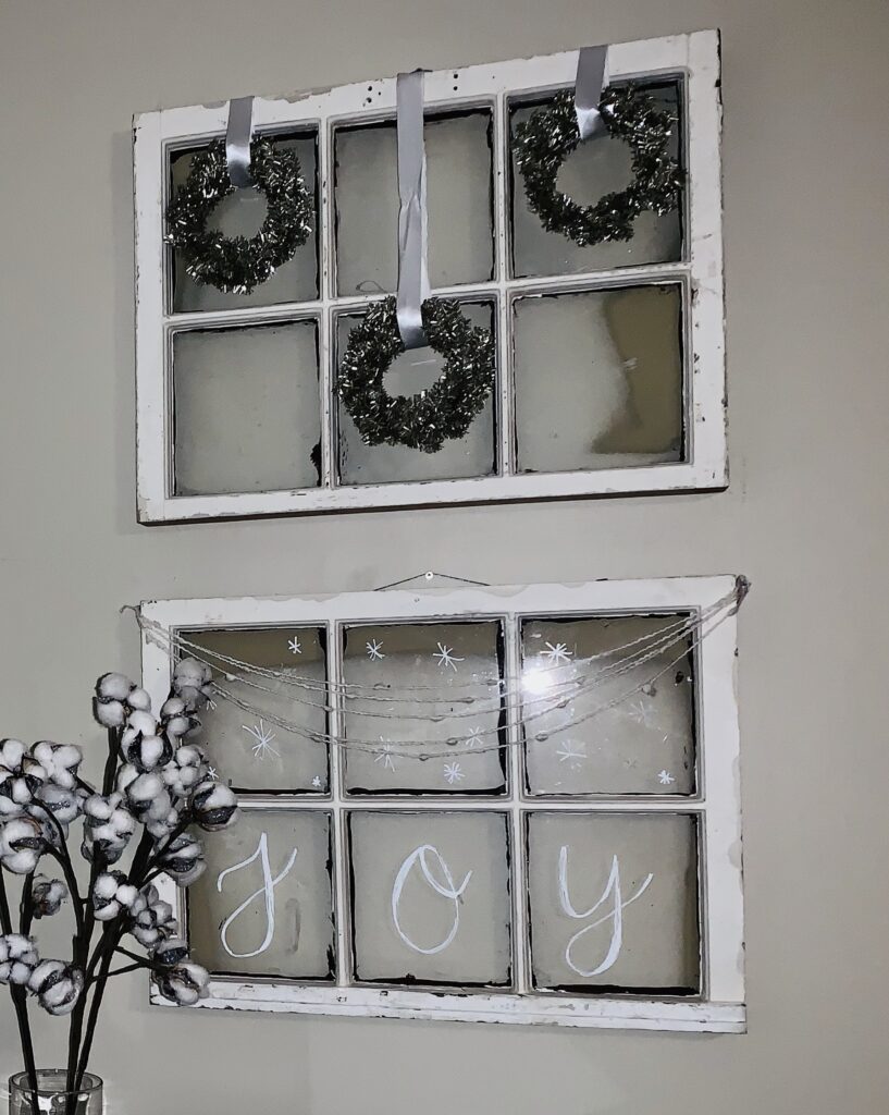 Windows with wreaths and handlettering