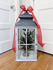 Large lantern decorated with a Christmas tree
