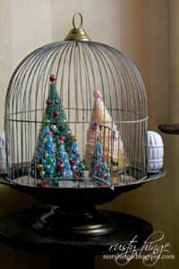 Christmas trees in a bird cage