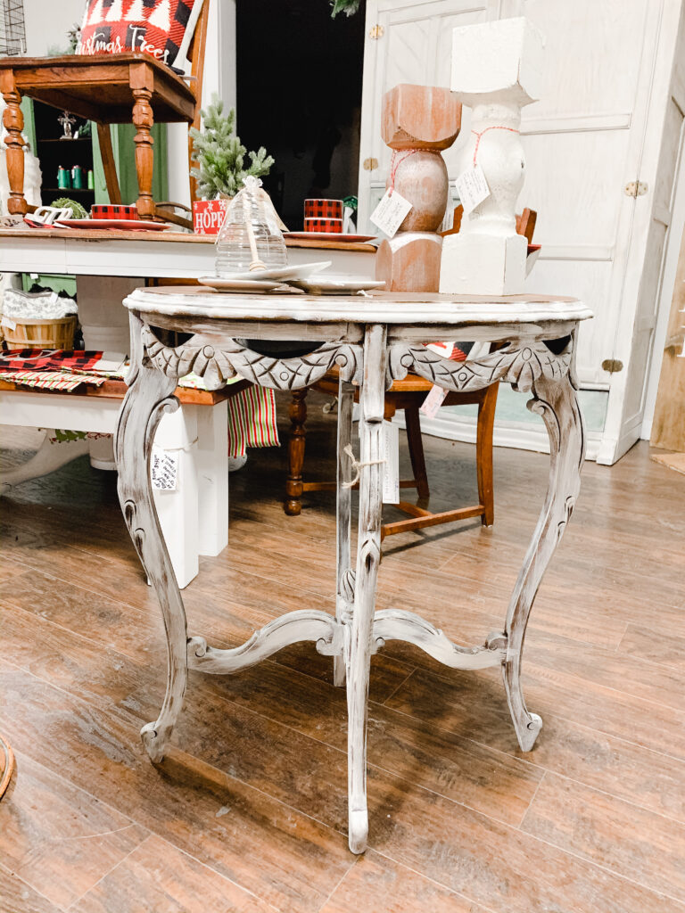 Refinished antique table with gingerbread trimmed with white dry brushed finish