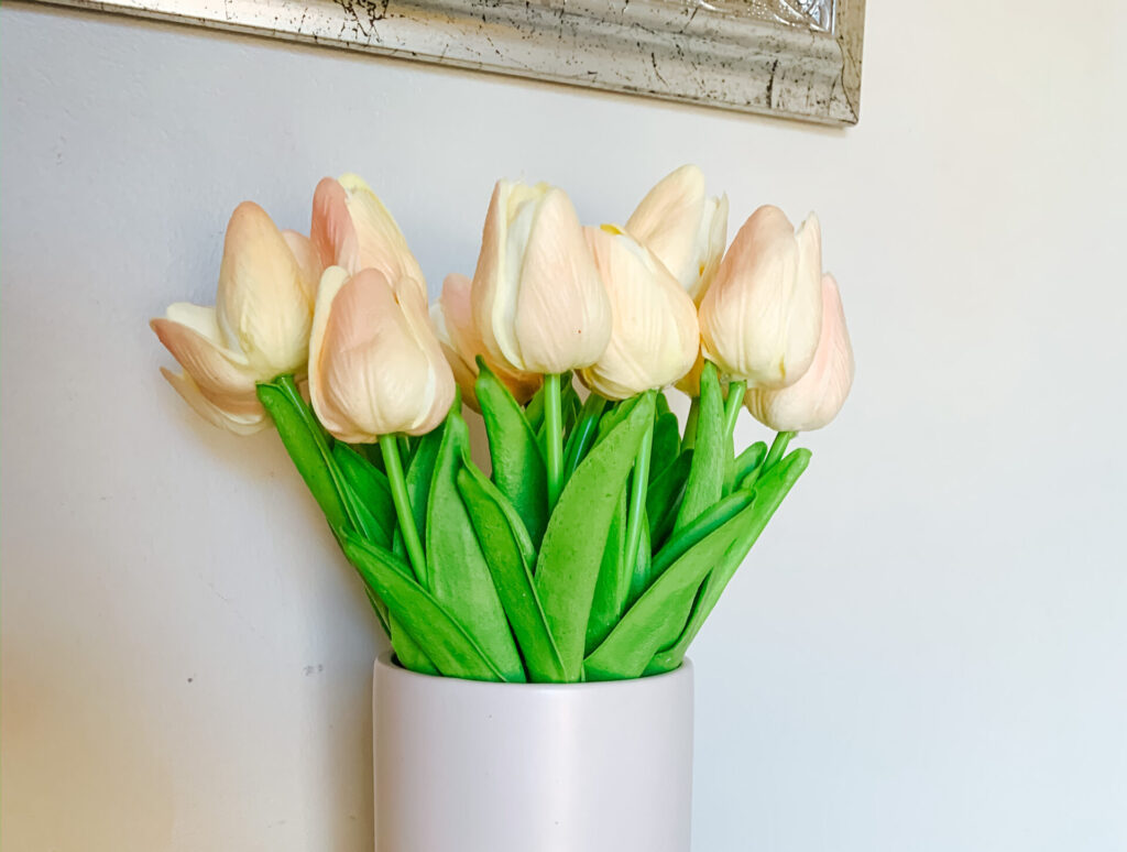 Vase of cream and blush artificial tulips