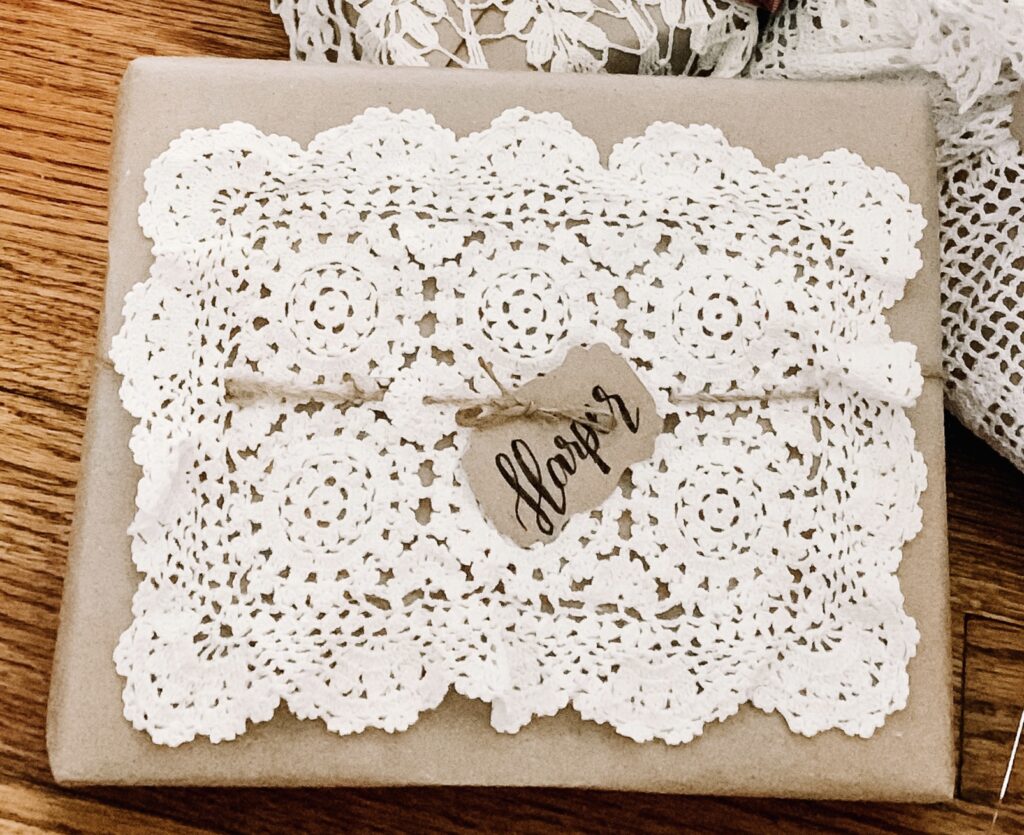 Doily topper on a brown paper package