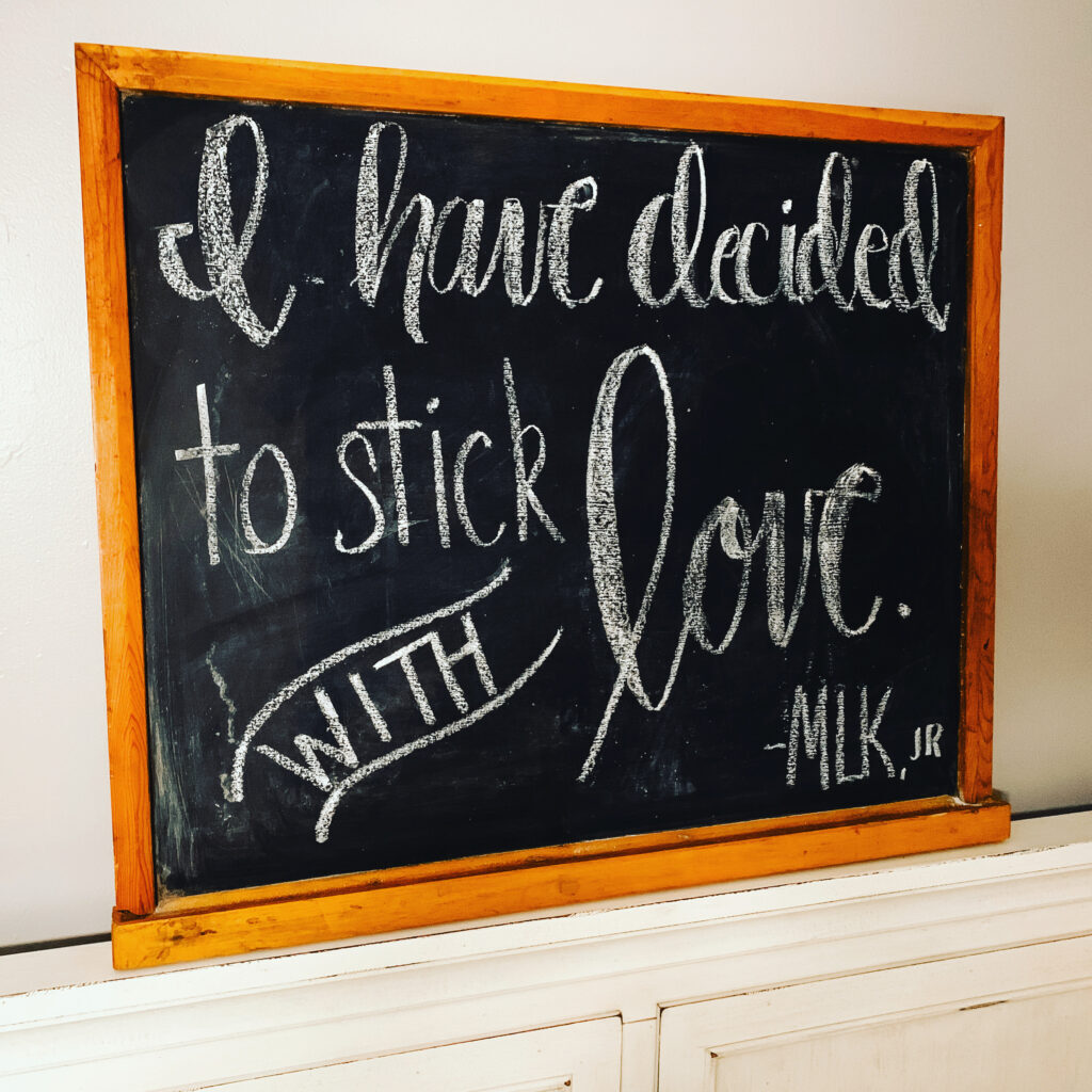Vintage blackboard with Martin Luther King Quote "I hav edecided to stick with love" hand lettered