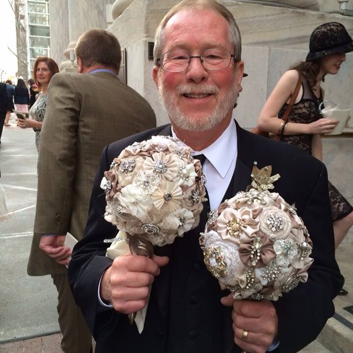 Dad holding brooch bouquets