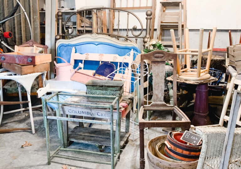 Garage of the saltbox house filled with antiques