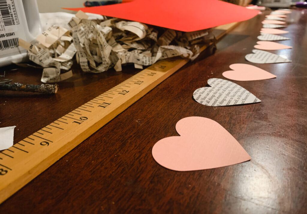 Alternating pink and book page hearts for a Valentine's Day garland
