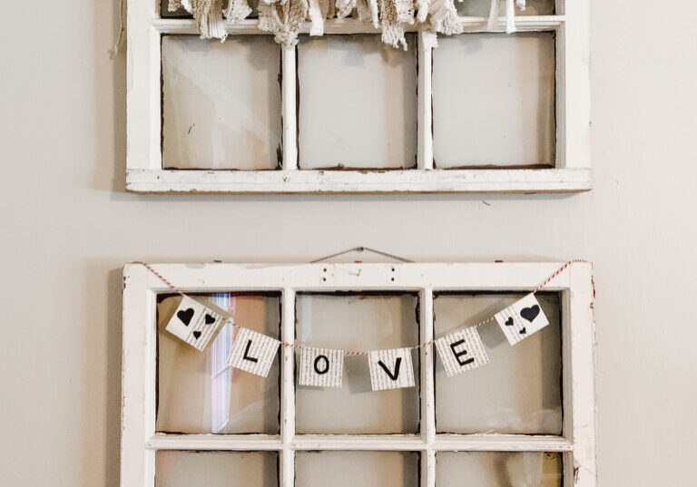 DIY book page bunting on an old window